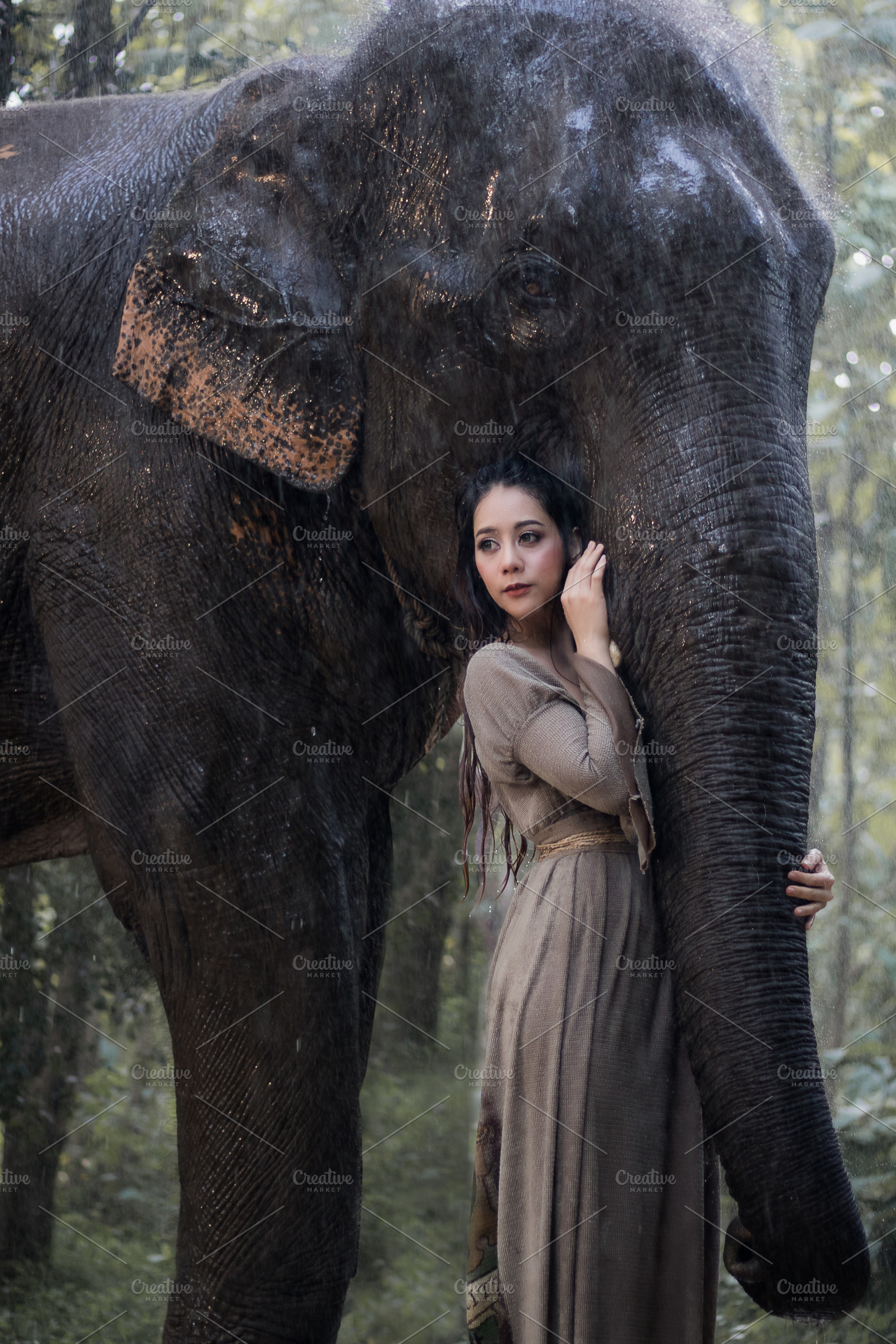 Asian woman and elephant, an Arts & Entertainment Photo by Guitarfoto Studio