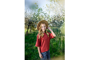 Girl enjoying spring blossoms in, a Nature Photo by HalfPoint
