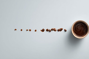 Coffee and beans in a line on table, a Photo by Beautiful things