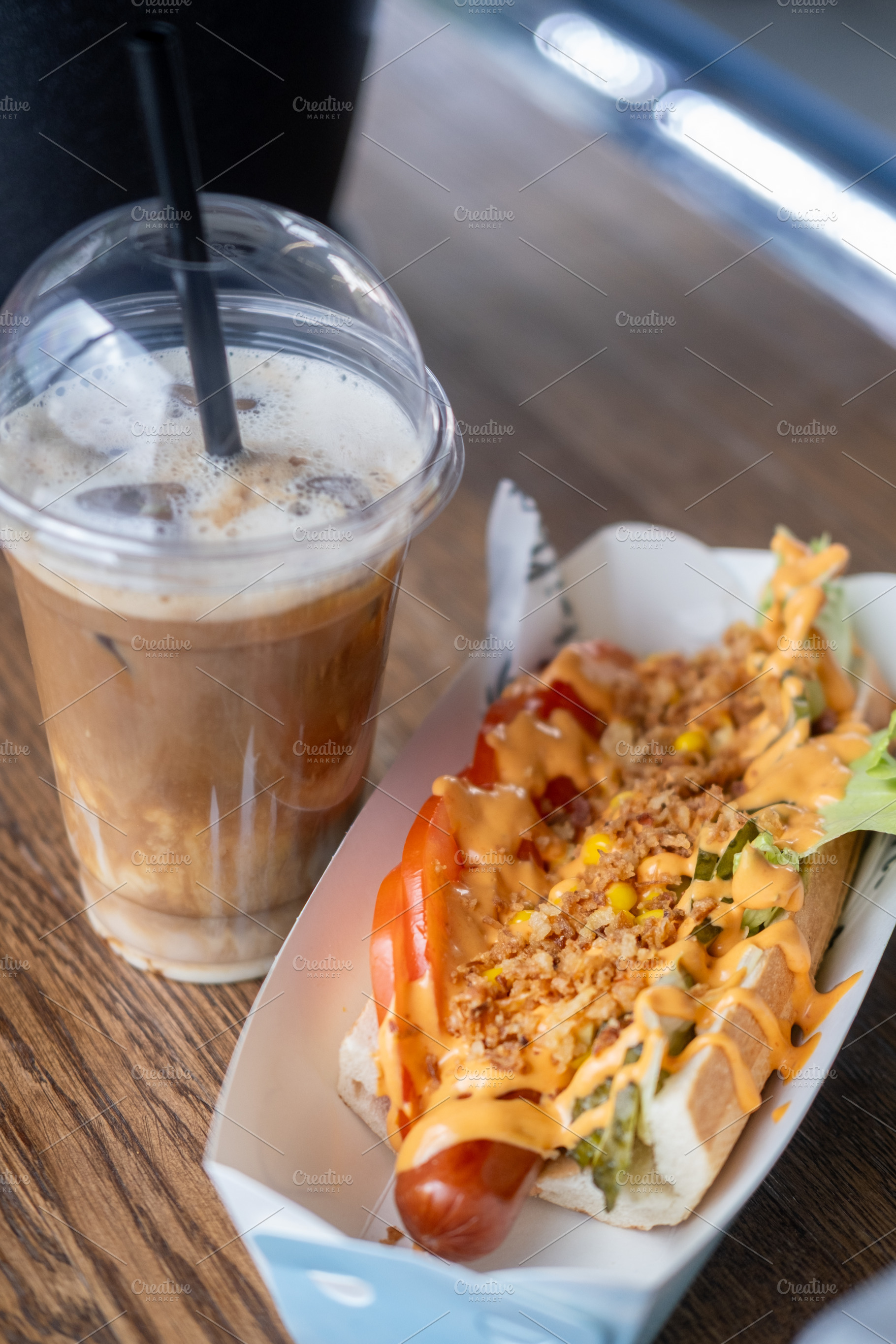 Takeaway meal street lunch hot dog sauce beverage, a Food & Drink Photo by Photo Drive Studio