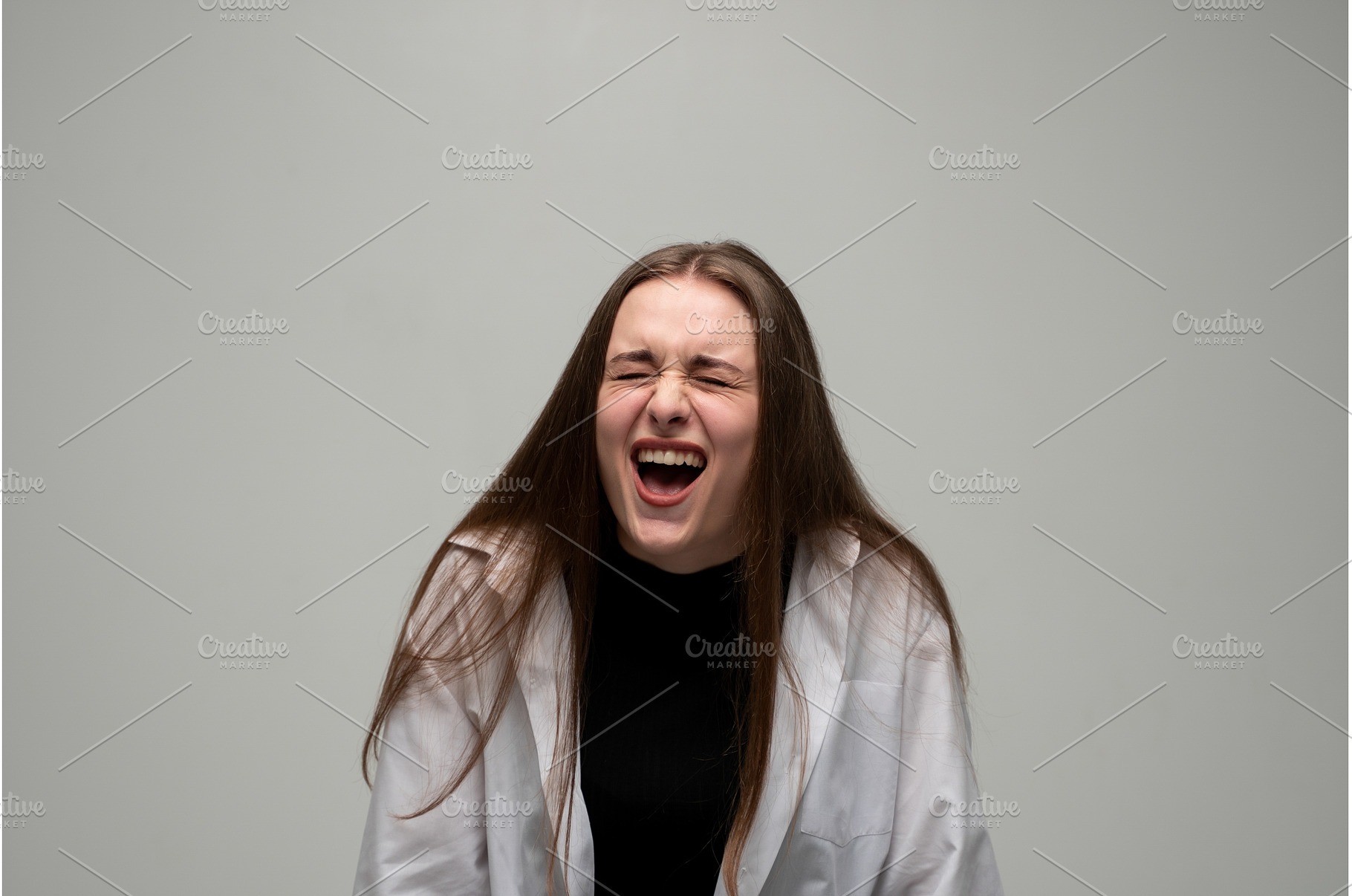 Young woman screaming loudly, a Person Photo by volodymyrshtun13795