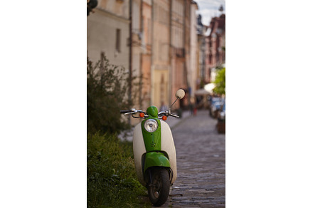 Retro scooter parked on city street., a Transportation Photo by Rohan Photography