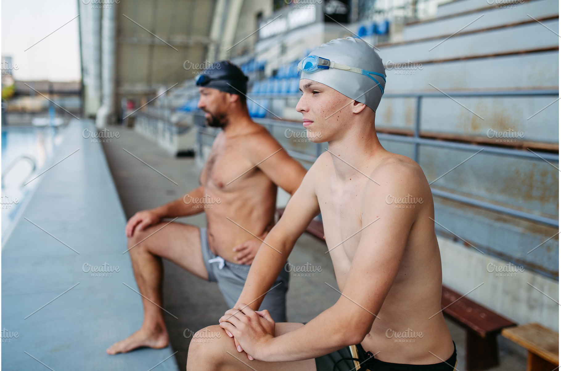 Father and teenage son preparing for, a Sports & Recreation Photo by HalfPoint
