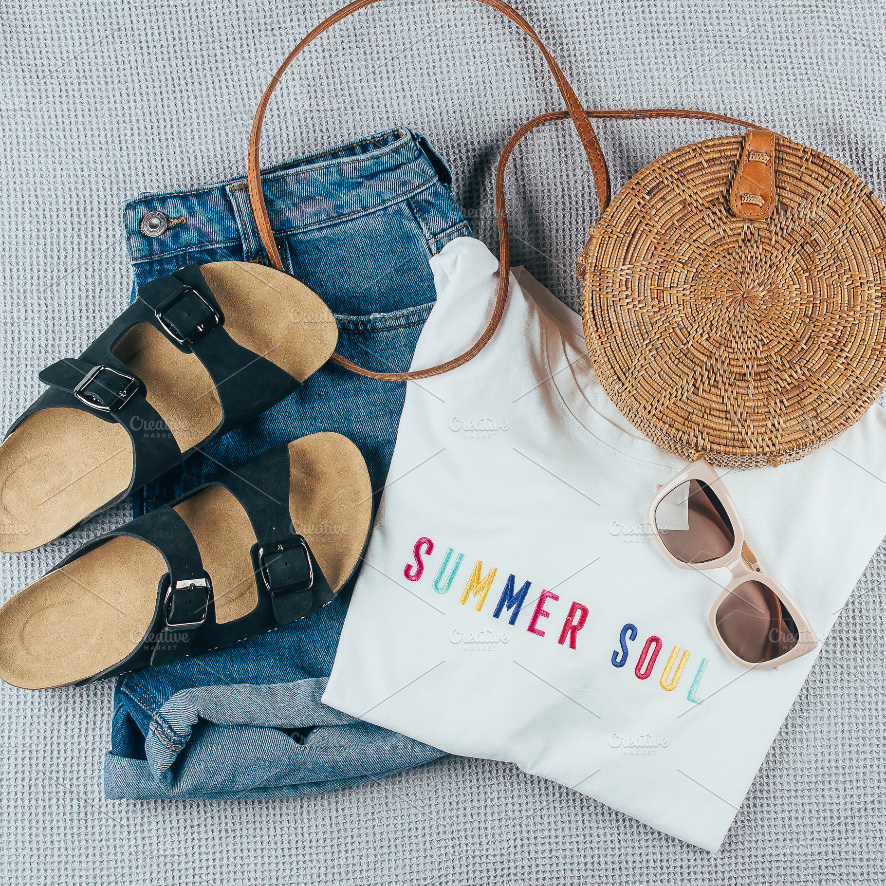 Flat lay with summer women's clothing and accessories. White t-shirt, denim sho, a Beauty & Fashion Photo by Anikona