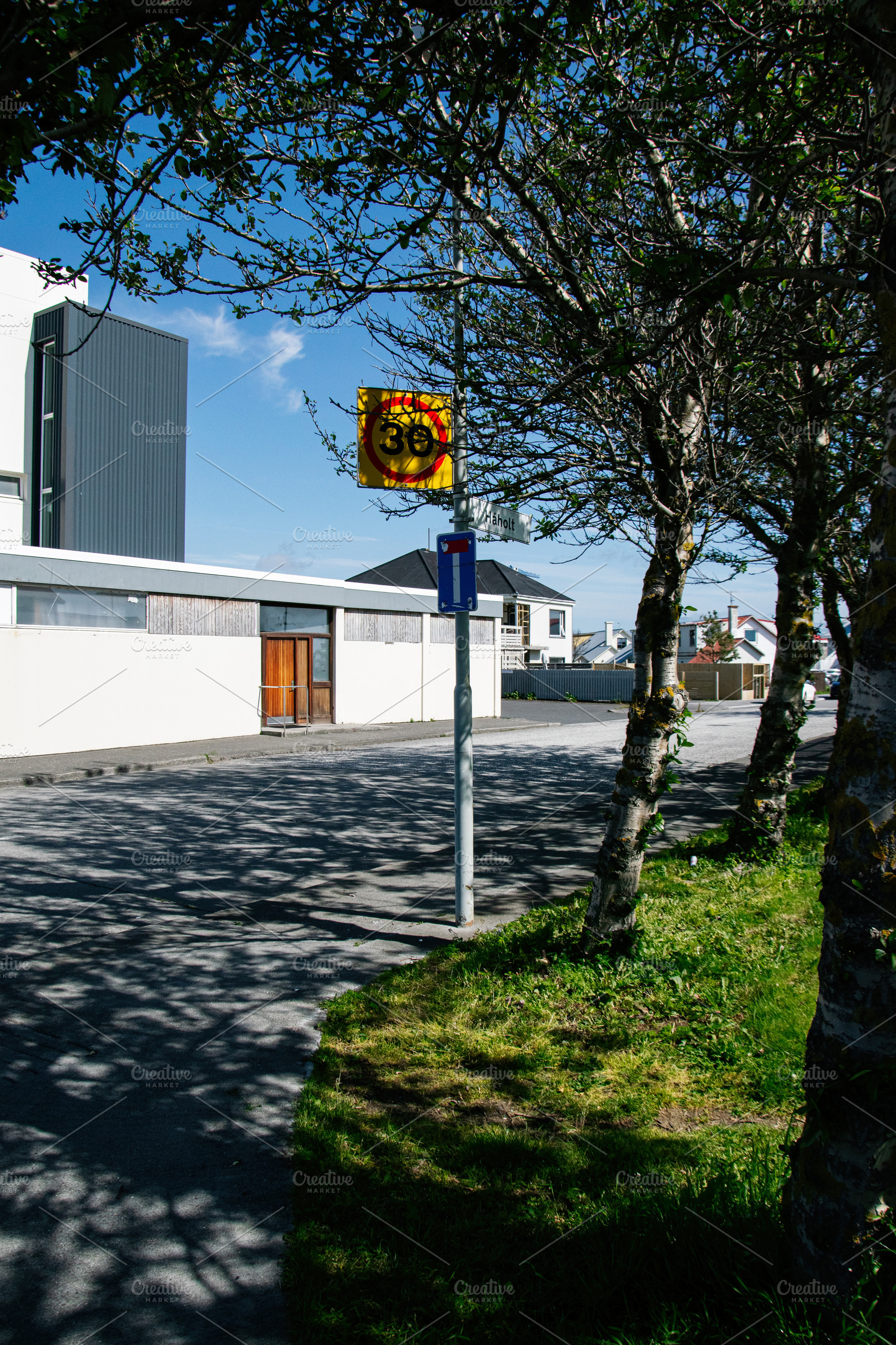 Speed limit sign on a charming suburban street in Akranes, Iceland, a Photo by AS photostudio