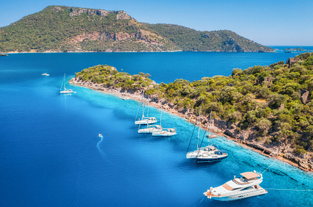 Aerial view of beautiful yachts, boats on the sea bay at sunset, a Nature Photo by den-belitsky