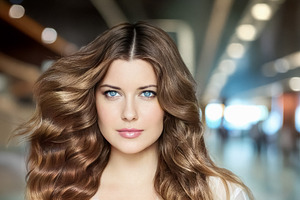 Young woman with luxurious wavy brown hair and sparkling blue ey, a Person Photo by Studio ANNA