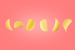 Potato chips isolated on pink