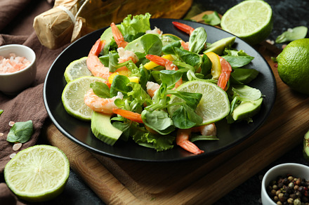 Concept of tasty eating with shrimp salad, close up, a Food & Drink Photo by AtlasStudio PRO