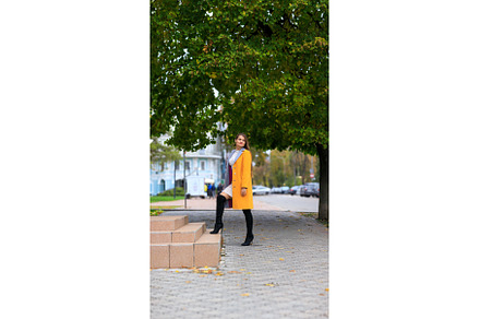 Young woman in yellow coat steps on, a Person Photo by serkum