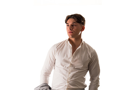 Man in white shirt posing for