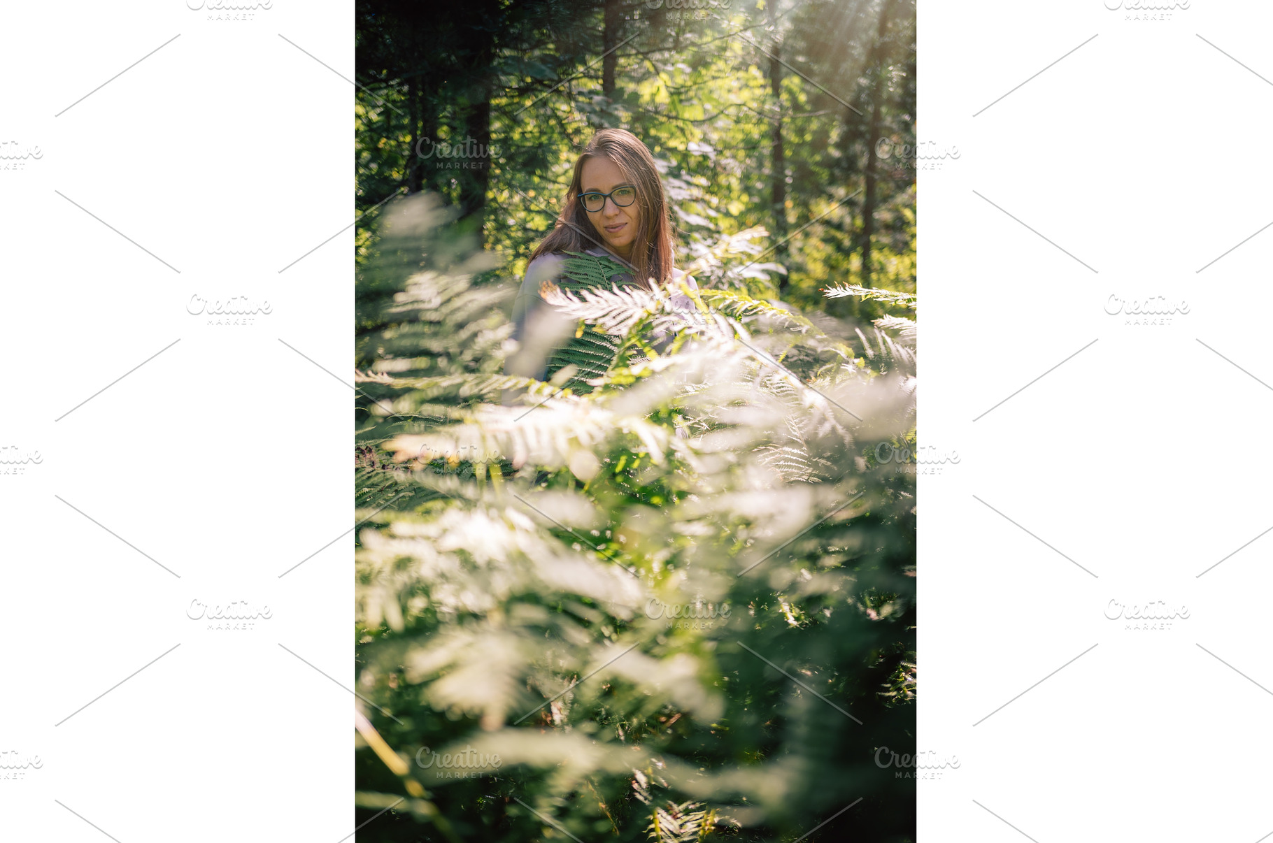 Woman Among Forest Ferns in Sunlight, a Person Photo by Jan Jack Russo Media