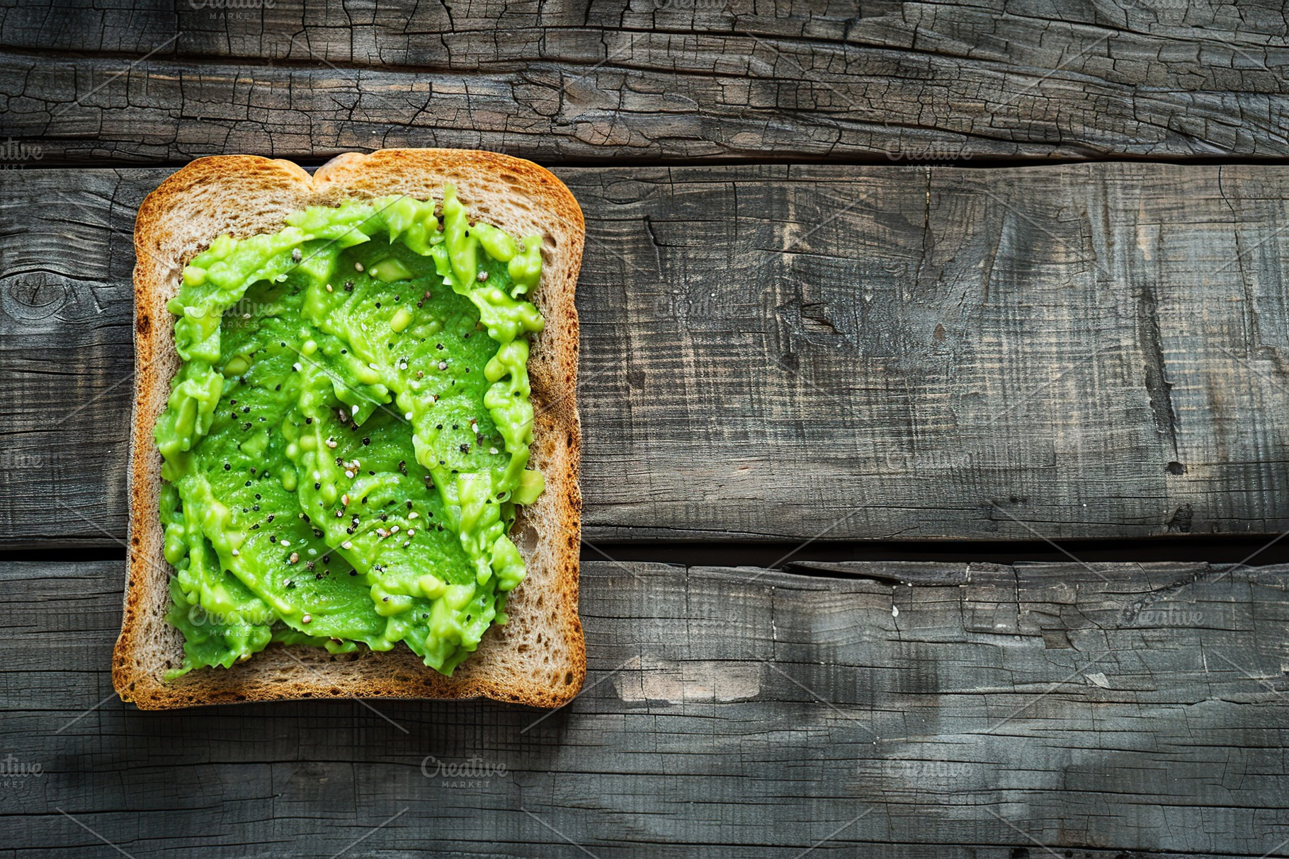 Toast bread with avocado puree on wooden table. Vegetarian food., a Food & Drink Photo by AlyaAnd