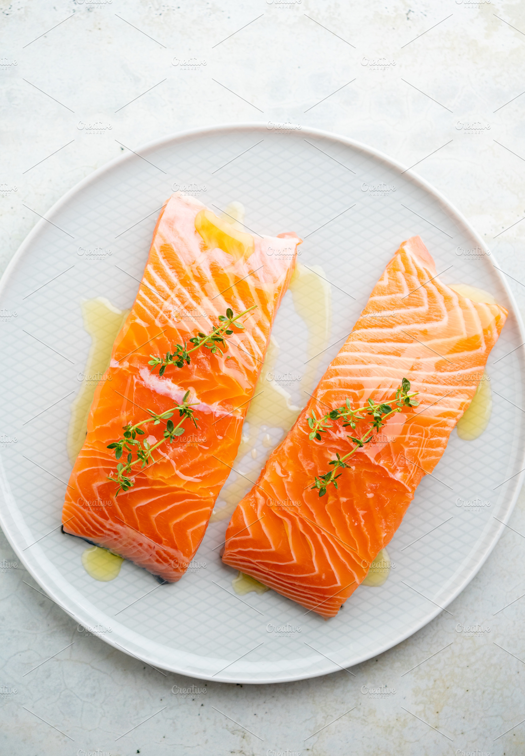 Fresh salmon fillet on a plate for delicious salmon steak., a Food & Drink Photo by FoodStock