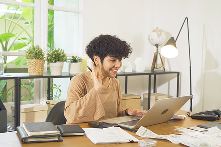 Business Asian american woman, person working from home, talking, a Photo by Tampatra