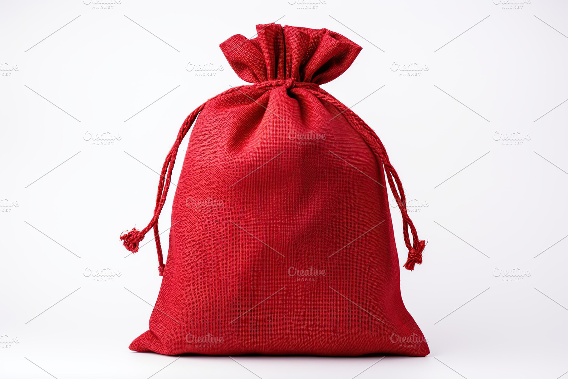 Red christmas sack isolated on white background, a Holiday Photo by AlyaAnd