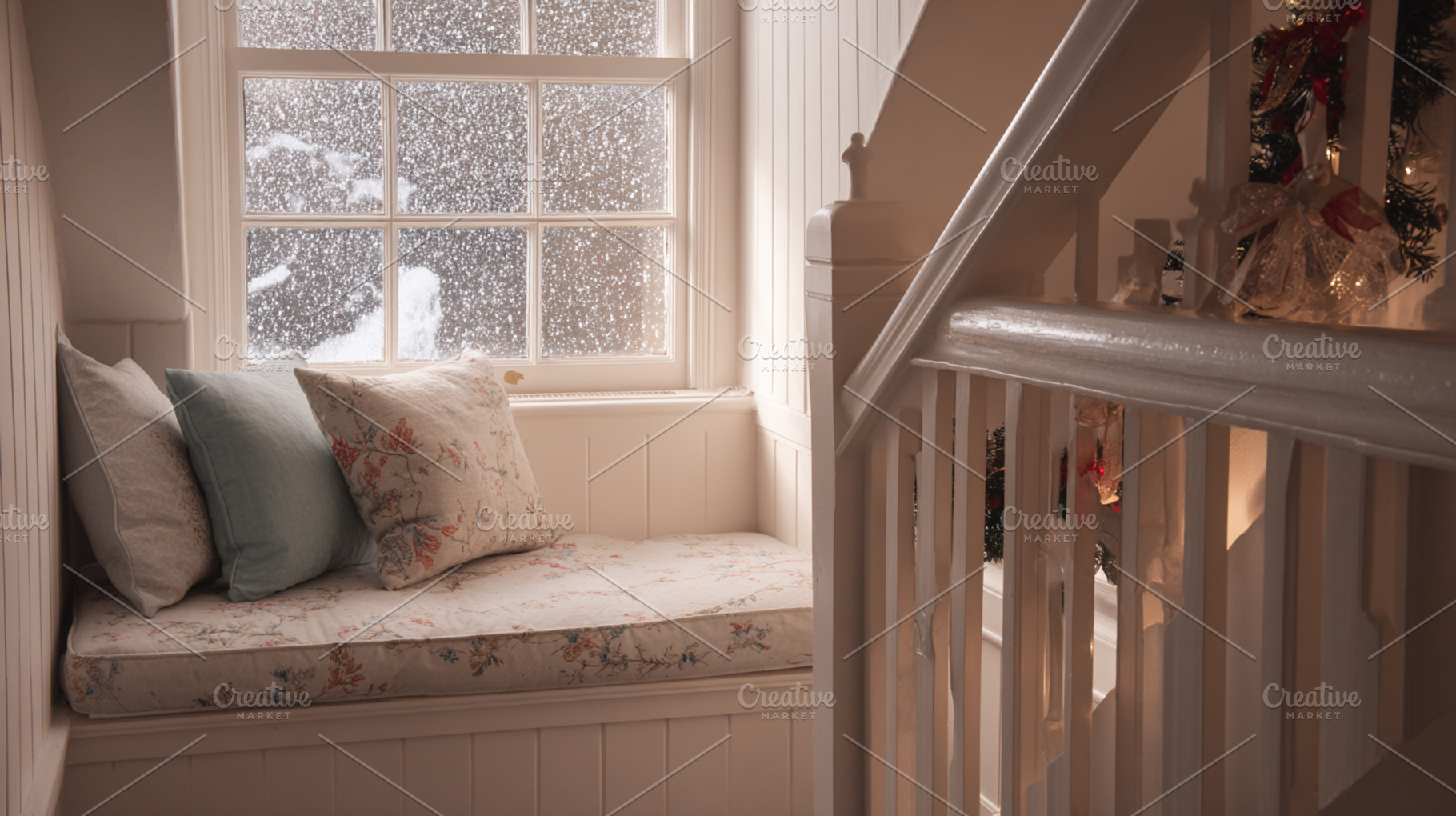 Cozy window seat creating a warm and inviting atmosphere inside a home while sn, a Photo by Studio ANNA