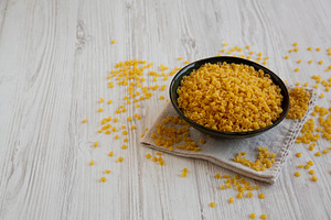 Homemade Perlini Pasta in a Bowl, side view. Copy space., a Food & Drink Photo by LiudmylaChuhunova