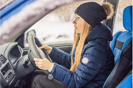 Woman in a car during a snowfall, a Transportation Photo by Elizaveta Galitskaya