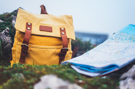 Traveler's map and backpack stock photo containing backpack and map
