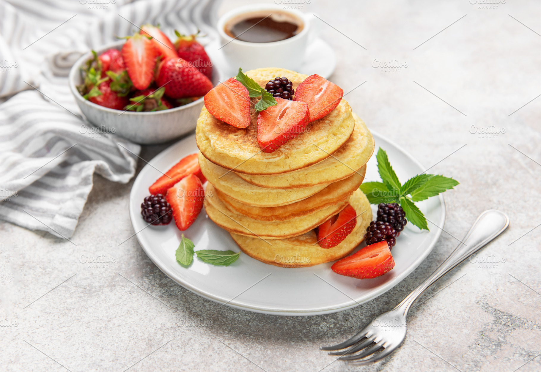 Stack of pancakes with fresh strawberries and blackberries for b, a Food & Drink Photo by Olena Rudo