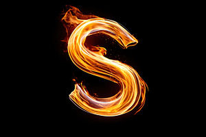 Swirling fire forms the letter S in an artistic display against a black backgro, an Arts & Entertainment Photo by AlyaAnd