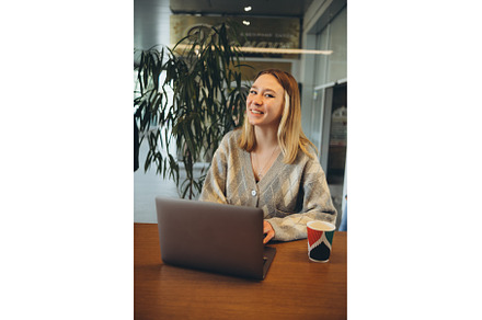 Girl working at her laptop sitting, a Person Photo by zheckasmk