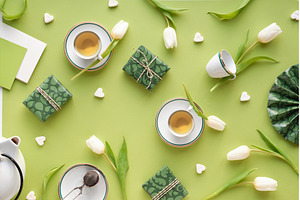Easter flatlay with green gift boxes, a Background Photo by tilialucida