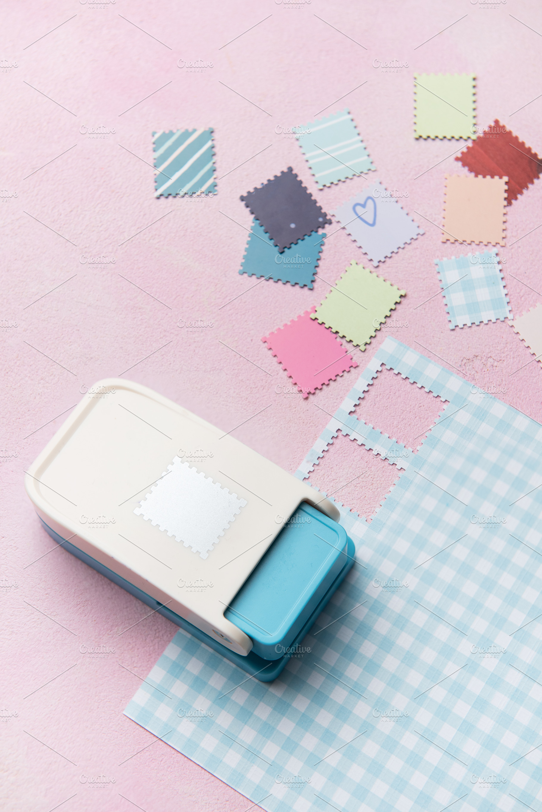 Paper punch creating decorative elements from colorful paper pie, an Arts & Entertainment Photo by Olena Rudo