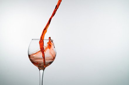 Red wine pouring into a wine glass containing wine, red, and drink, a Food & Drink Photo by oleghz