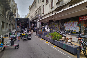 Film crew on location in pedestrian street with old buildings, an Architecture Photo by DanFLCreativo