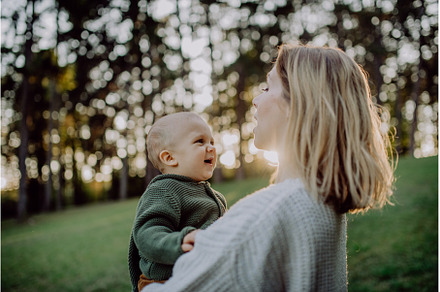 Mother holding her little baby son, a Nature Photo by HalfPoint