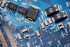 Macro shot of blue electronic circuit board with microchips and capacitors., a Technology Photo by Rohan Photography