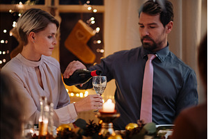 Christmas toast with white wine., a Person Photo by HalfPoint