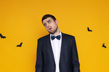 Concept of Halloween, young man on yellow background, a Person Photo by AtlasStudio PRO