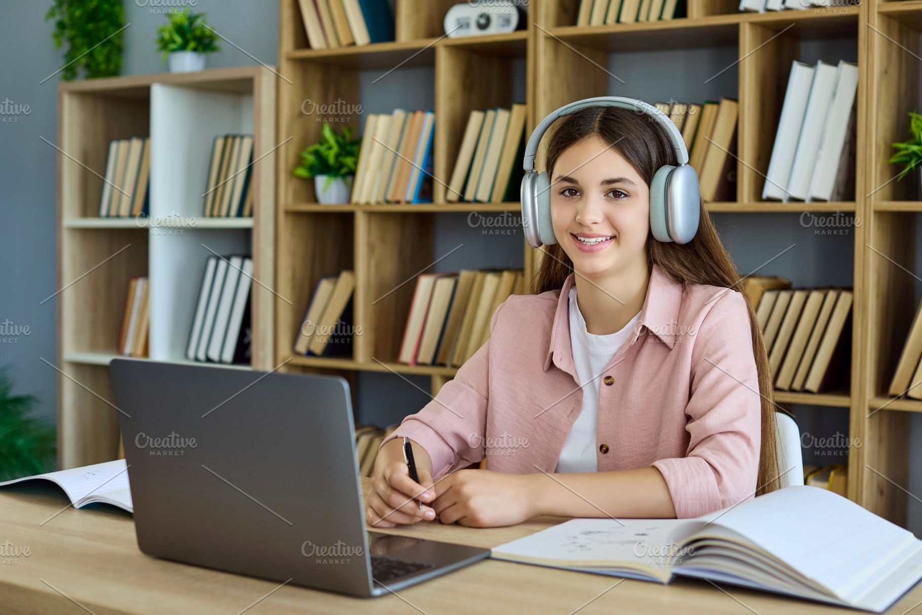 Teen Girl in Headphones on Lesson, a Person Photo by StudioRomantic