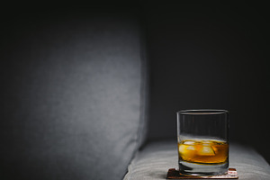 Glass of whisky with ice