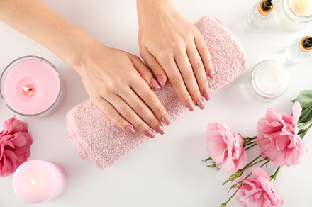 Concept of hand care with cosmetics on white background, a Beauty & Fashion Photo by AtlasStudio PRO