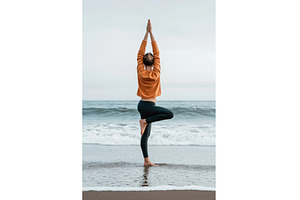 A woman practices yoga in a tree, a Nature Photo by Sergey Kotenev