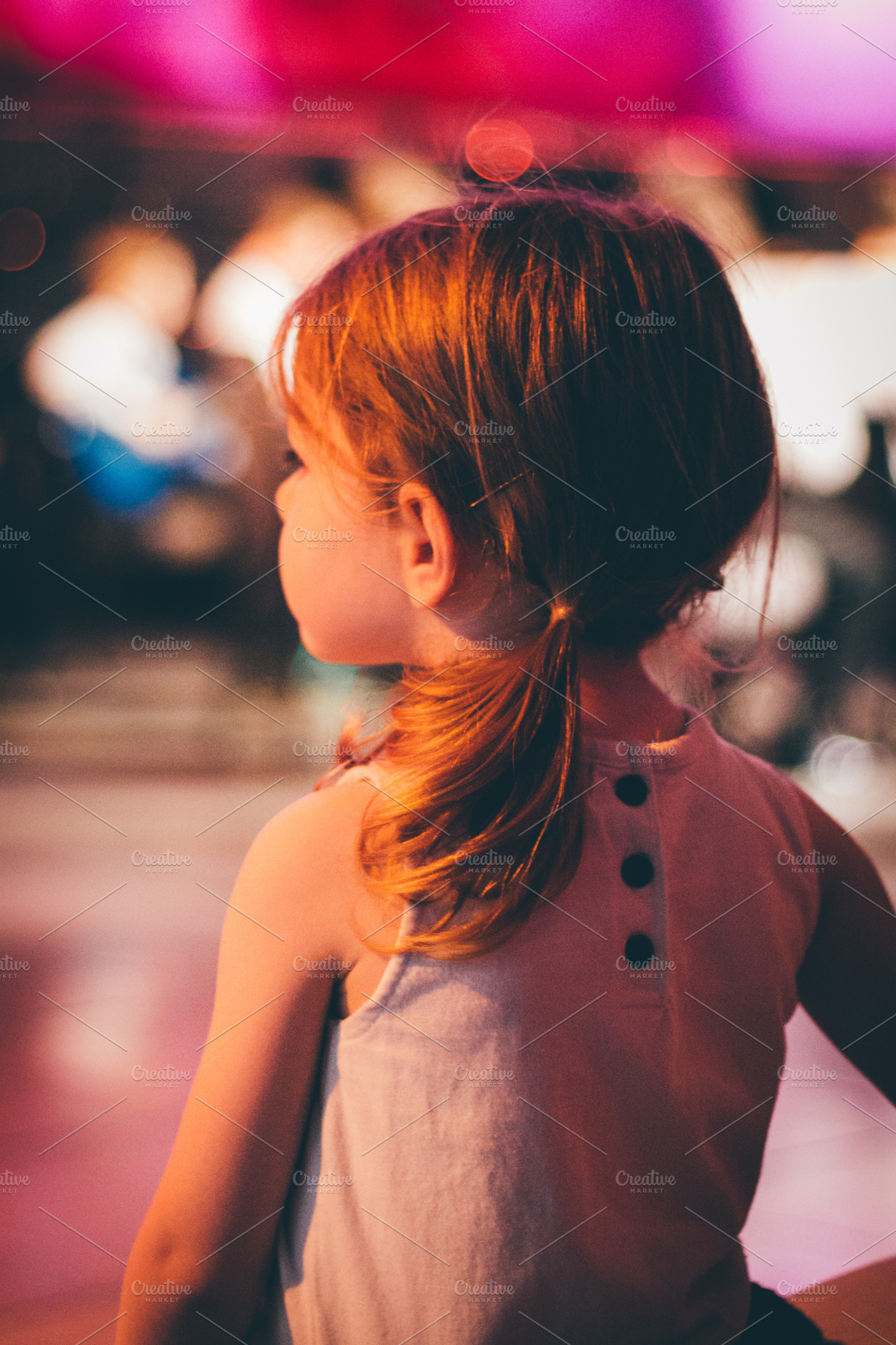 little girl watching the band play