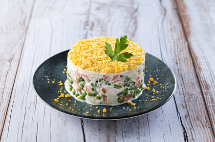 Russian salad or Olivier salad for Christmas dinner on wooden ta, a Food & Drink Photo by etorres69