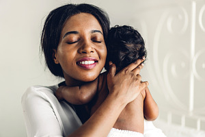 Portrait of enjoy happy love family african american mother play