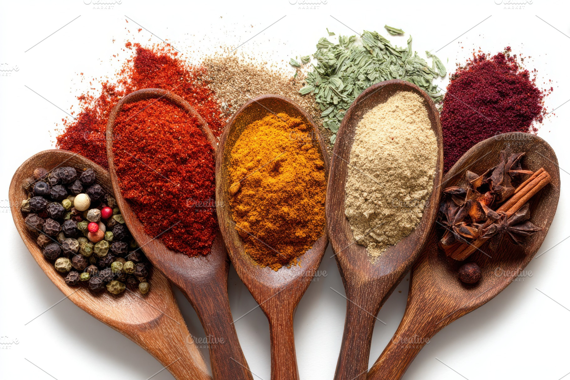 Colorful spices in wooden spoons cul, a Photo by Pixeness Studio
