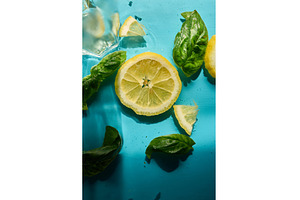 Fresh lemon slices with basil and, a Food & Drink Photo by IlliaBondarPhotography