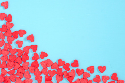 Border frame of red hearthshape sprinkle on blue background stock photo, a Holiday Photo by Fascinadora
