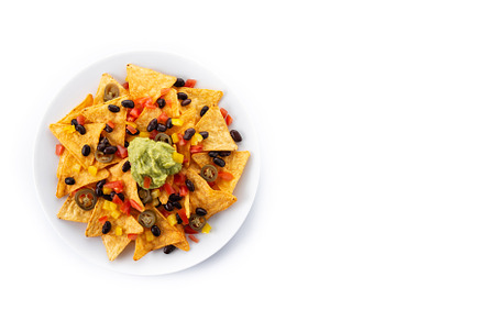 Mexican nachos tortilla chips with black beans, guacamole, tomato and jalapeno, a Background Photo by etorres69