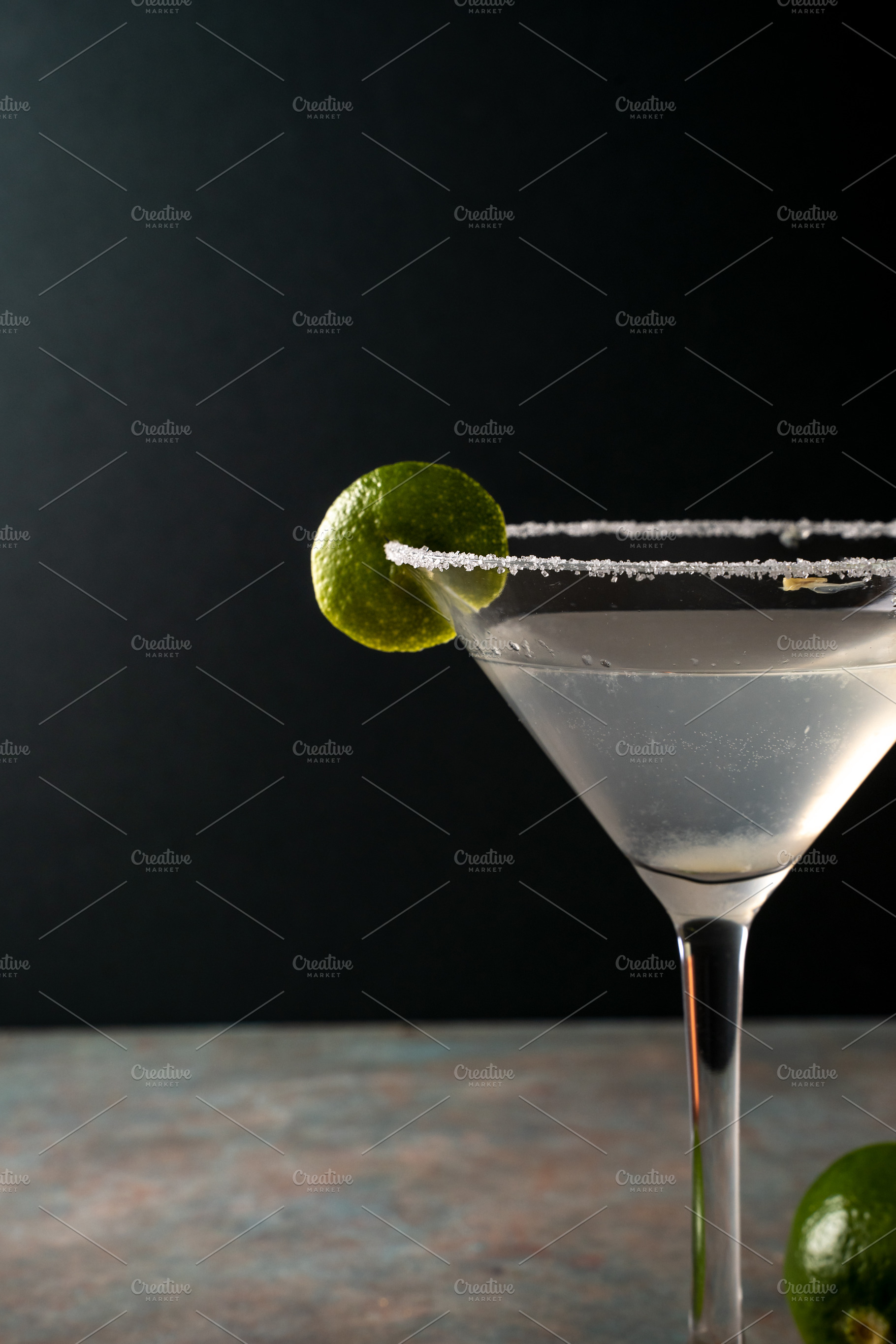 Margarita cocktail with lime in a salted rimmed glass on earthy, a Food & Drink Photo by SZ IMAGE