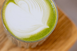 Natural beverage served matcha glass garnished, a Food & Drink Photo by Photo Drive Studio
