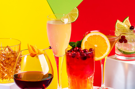 Summer cocktails in glasses with rum, gin, prosecco and liquors.