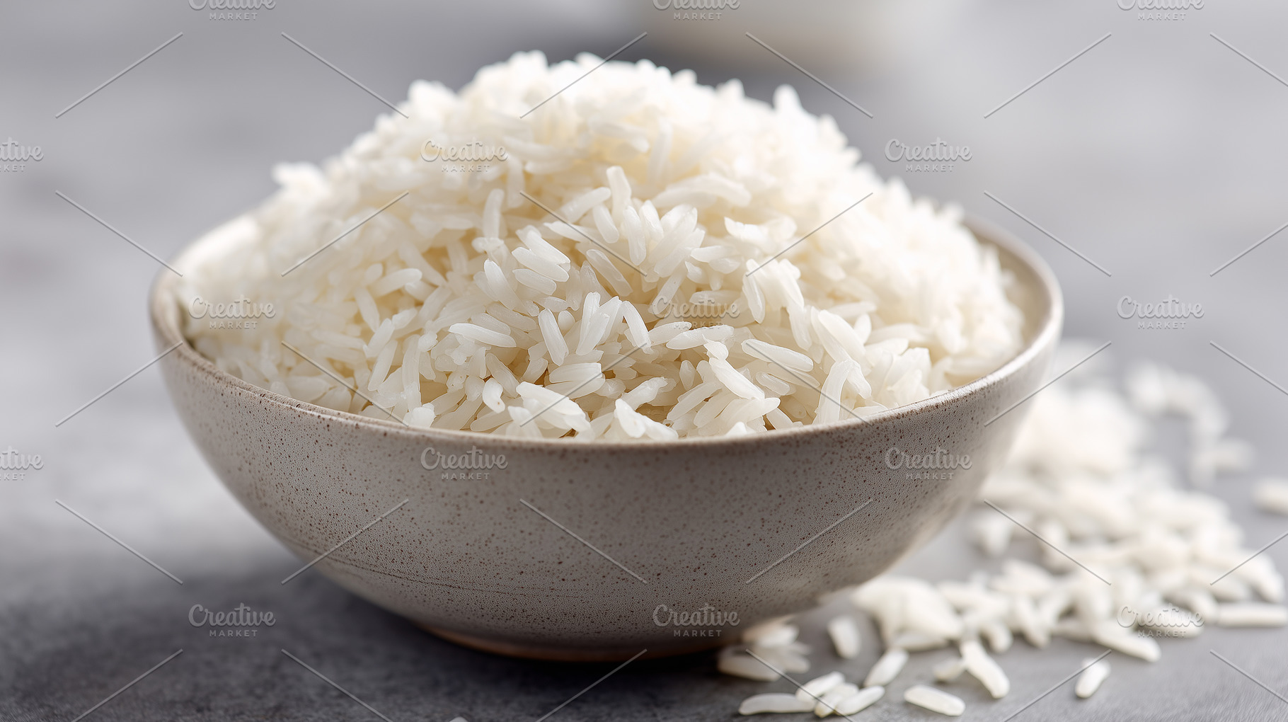 Bowl of cooked white rice on a gray, a Food & Drink Photo by MistyDay